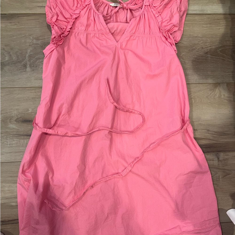Bubble gum pink, thigh length dress, ruffle sleeves, tie in front & around waist